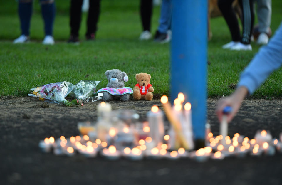 Flowers, soft toys and candles are seen at a vigil at the scene in Chandos Crescent, Killamarsh, near Sheffield, where four people were found dead at a house on Sunday. Picture date: Monday September 20, 2021.