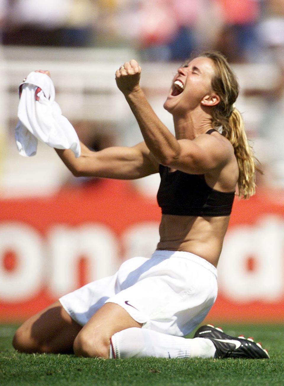 Brandi Chastain of the US celebrates after kicking the winning penalty shot to win the 1999 Women's World Cup final against China on July 10, 1999 at the Rose Bowl in Pasadena. The US won 5-4 on penalty kicks.
