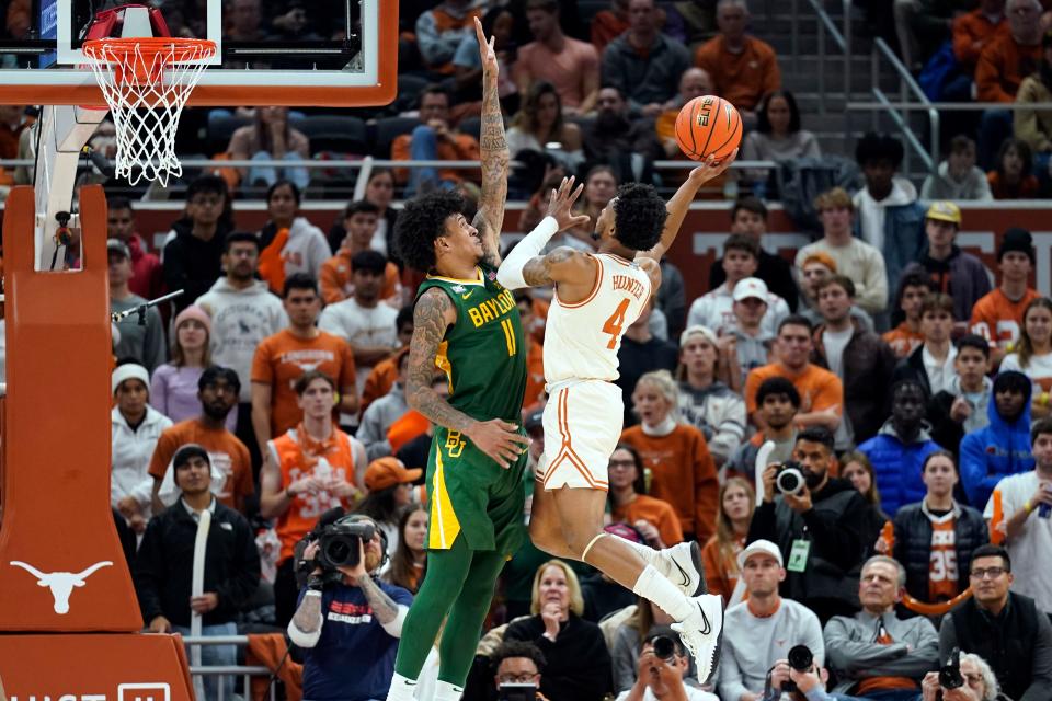 Texas guard Tyrese Hunter (4) shoots over Baylor forward Jalen Bridges (11) during the second half of their game at Moody Center earlier this season.