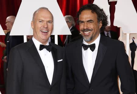 Michael Keaton (L), nominated for Best Actor for the film "Birdman" and Alejandro Gonzalez Inarritu, nominated for Best Director for the same film, arrive at the 87th Academy Awards in Hollywood, California February 22, 2015. REUTERS/Lucas Jackson