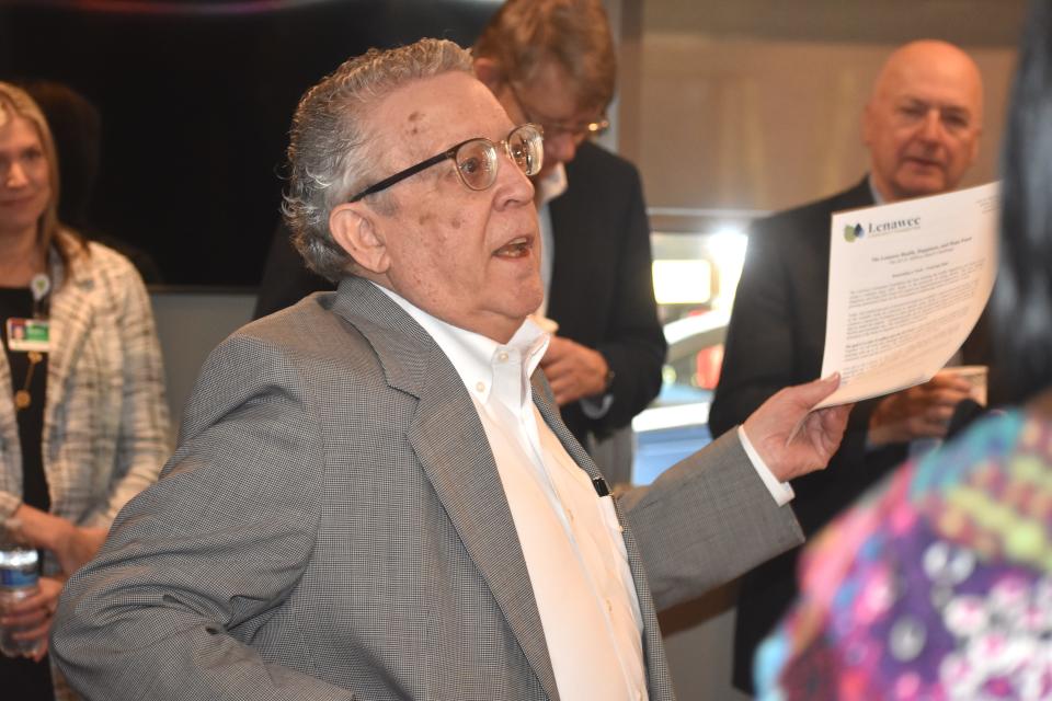 David Hickman, chairman of the Lenawee Community Foundation's board of directors, introduces the foundation's new president and CEO, Bronna Kahle, during a reception for Kahle Jan. 17, 2023, at the foundation offices in Adrian.