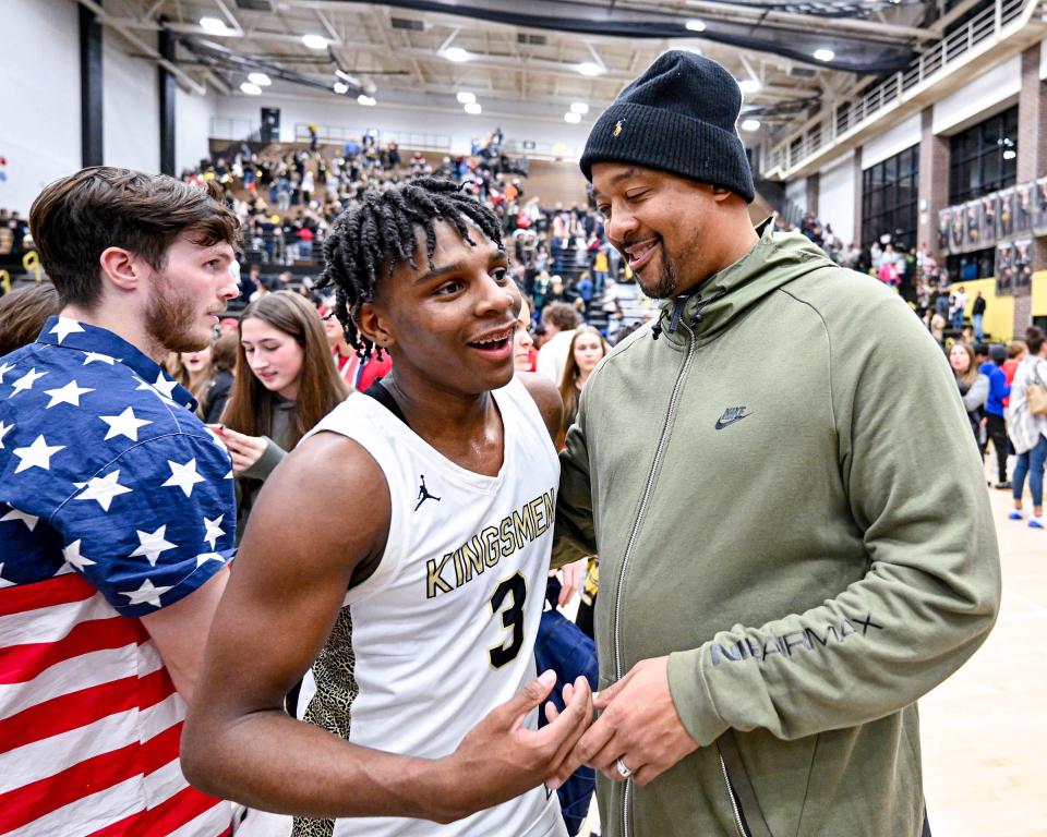 Penn's Markus Burton (3) talks with Notre Dame Men’s Basketball assistant coach Antoni Wyche following Penn’s 66-52 win over Marian Friday, Jan. 20, 2023, at Penn High School.