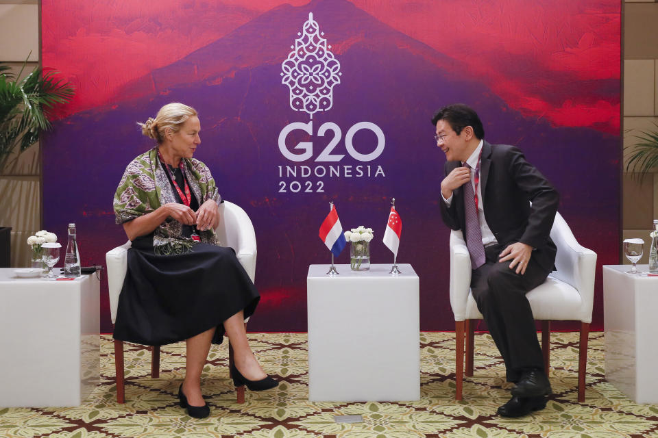 Singaporean Finance Minister Lawrence Wong, right, talks with Dutch Finance Minister Sigrid Kaag during their bilateral meeting on the sidelines of the G20 Finance Ministers and Central Bank Governors Meeting in Nusa Dua, Bali, Indonesia, Saturday, July 16, 2022. (Made Nagi/Pool Photo via AP)