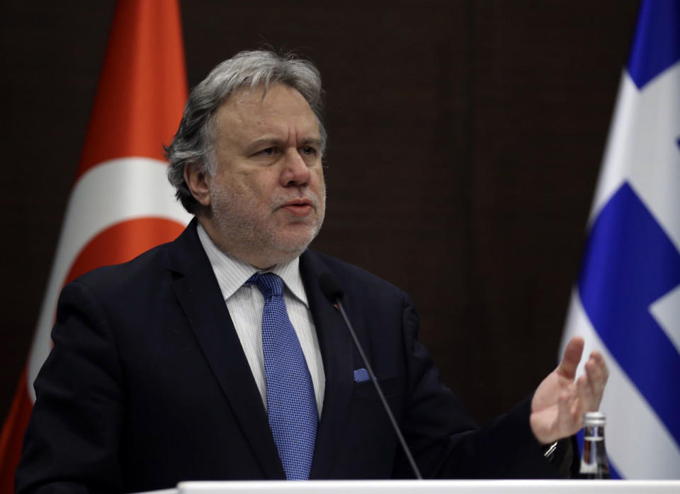 Greek Foreign Minister Giorgos Katrougalos speaks to the media during a joint news conference with Turkey's Foreign Minister Mevlut Cavusoglu in the Mediterranean coastal city of Antalya, Turkey, Thursday, March 21, 2019. Cavusogly says the defense chiefs of Turkey and Greece could meet soon as part of new confidence-building measures aimed at reducing tensions between the NATO allies. (Turkish Foreign Ministry via AP, Pool)