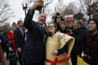 <p>Sen. Cory Booker, D-N.J., left, takes a selfie with Caitlin Rooney, who is with the Center for American Progress and dressed as the Constitution, during a rally outside of the Supreme Court which is hearing the ‘Masterpiece Cakeshop v. Colorado Civil Rights Commission’ today, Tuesday, Dec. 5, 2017, in Washington. (Photo: Jacquelyn Martin/AP) </p>