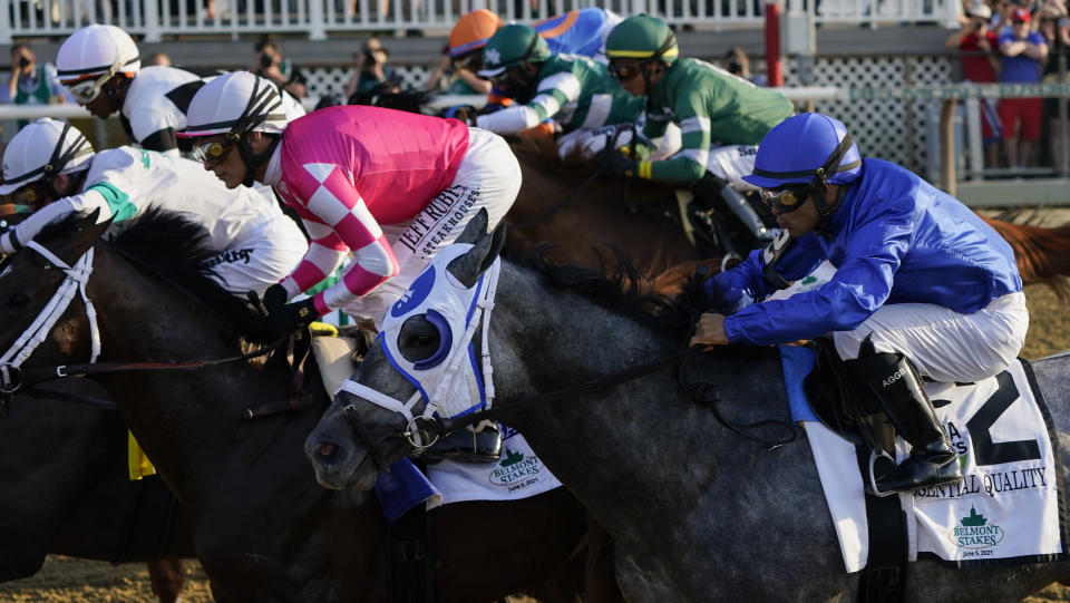 Essential Quality (2), with jockey Luis Saez up, breaks down the track at the start of the 153rd running of the Belmont Stakes horse race, Saturday, June 5, 2021, at Belmont Park in Elmont, N.Y. (Essential Quality (2) won the race. AP Photo/Seth Wenig)