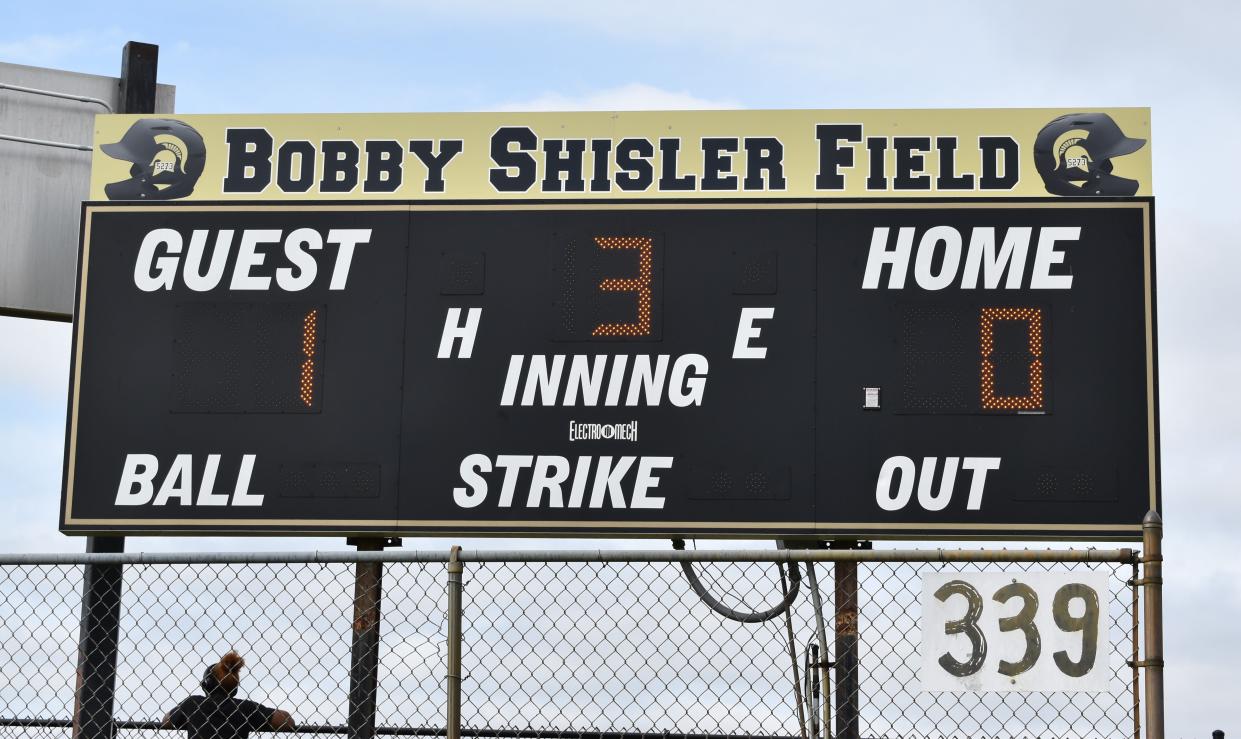 A scoreboard sign at West Deptford High School honors slain township police officer Bobby Shisler.