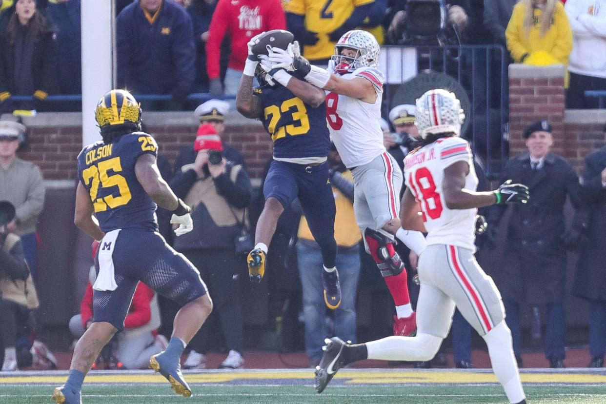 Michigan linebacker Michael Barrett breaks up a pass intended for Ohio State tight end Cade Stover during the first half at Michigan Stadium in Ann Arbor on Saturday, Nov. 25, 2023.