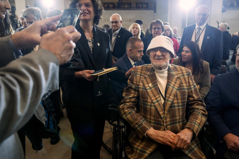 Bernard Bluestein, of Hoffman Estates, Ill., talks with well-wishers after a ceremony to honor members of their secretive WWII-era unit with the Congressional Gold Medal on Capitol Hill, Thursday, March 21, 2024, in Washington. (AP Photo/Mark Schiefelbein)