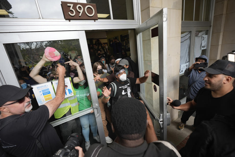 Pro-Palestinian demonstrators disperse from Dodd Hall as requested by the police on the UCLA campus on Thursday, May 23, 2024, in Los Angeles. (AP Photo/Ryan Sun)
