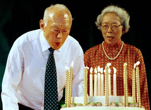 Singapore's Senior Minister Lee Kuan Yew blows out candles on his birthday cake as his wife Kwa Geok Choo looks on at a ceremony held to celebrate his 77th birthday and the launch of his new book in Singapore Saturday, Sept. 16, 2000. Lee wrote in his new book that he believes that Singapore could disappear as a sovereign state if foreign powers fail to maintain stable relations with each other. (AP Photo/Edward Wray)