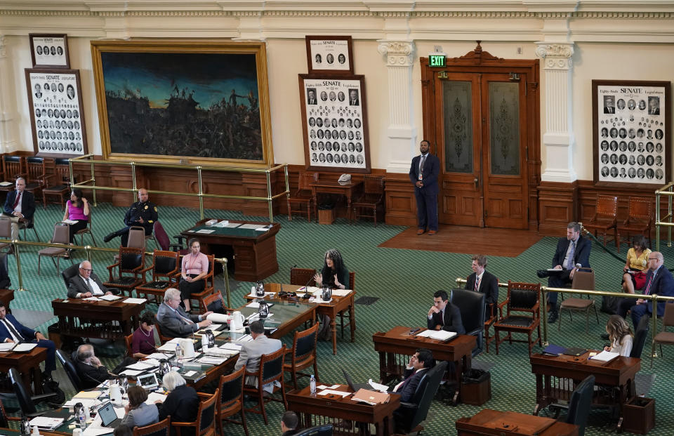 Aurora Vasquez, Sandy Hook Promise Vice President for State Policy and Engagement, center, testifies on the second day of a hearing in the state senate chamber, Wednesday, June 22, 2022, in Austin, Texas. The hearing is in response to the recent school shooting at Robb Elementary School in Uvalde, Texas, where two teachers and 19 students were killed. (AP Photo/Eric Gay)