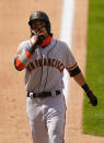 San Francisco Giants' Mauricio Dubon reacts at he reaches home plate after hitting a three-run home run in the seventh inning of a baseball game against the Colorado Rockies, Thursday, Aug. 6, 2020, in Denver. (AP Photo/Jack Dempsey)