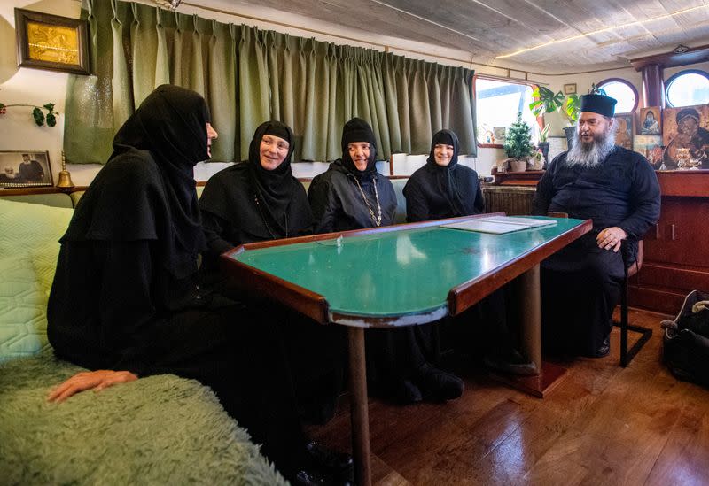 Nuns and father Abbot Abibos sit in the livingroom of a mobile Georgian Orthodox monastery in Vlissingen