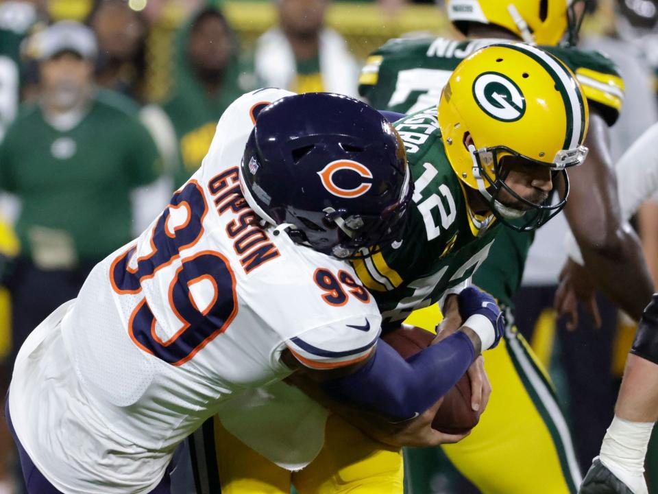 Chicago Bears linebacker Trevis Gipson sacks Green Bay Packers quarterback Aaron Rodgers.