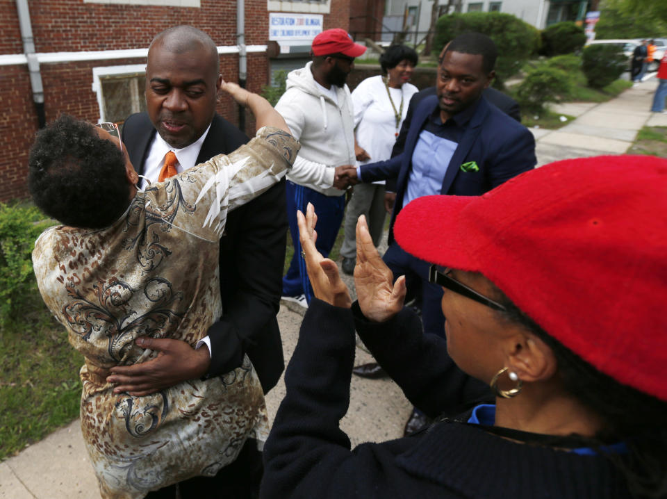 Newark mayoral candidate Ras Baraka, second from left, is greeted by supporters before casting his vote, Tuesday, May 13, 2014, in Newark, N.J. Tuesday's election will decide whether Baraka, a Newark city councilman, or opponent Shavar Jeffries, a former state assistant attorney general, will take over the seat Cory Booker occupied from 2006 until October 2013, when he won a special election to succeed U.S. Sen. Frank Lautenberg, who died in office. (AP Photo)