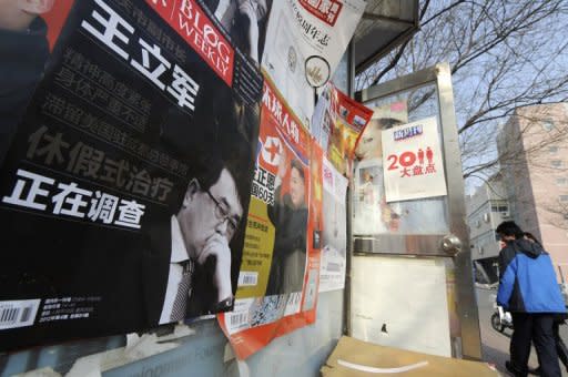 This file photo shows a poster of a Chinese magazine showing former Chongqing's police chief Wang Lijun, in Beijing, in February. Wang will go on trial in southwest China next week, a court said, the latest stage in a scandal that has rocked the Communist party ahead of a 10-yearly power handover