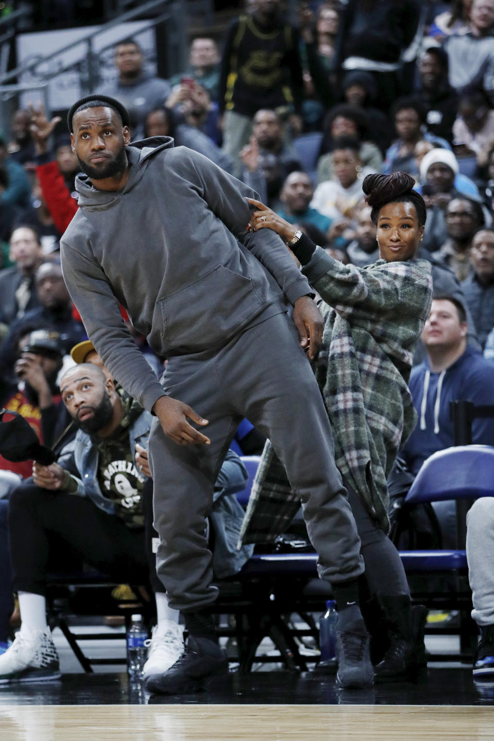 LeBron James and Savannah James enjoying Bronny&#39;s basketball game.