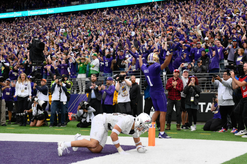 Oct 14, 2023; Seattle, Washington, USA; Washington Huskies wide receiver Rome Odunze (1) celebrates scoring a touchdown against the Oregon Ducks in the late fourth quarter at Alaska Airlines Field at Husky Stadium. Mandatory Credit: Steven Bisig-USA TODAY Sports