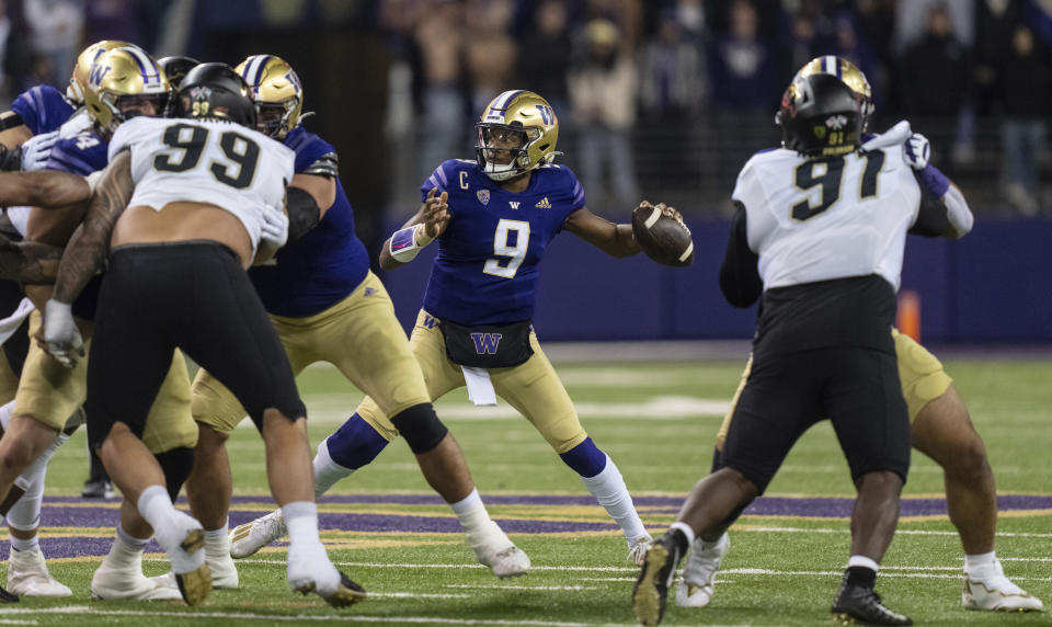 Washington quarterback Michael Penix Jr. prepares to throw a pass during the first half of the team's NCAA college football game against Colorado, Saturday, Nov. 19, 2022, in Seattle. (AP Photo/Stephen Brashear)