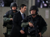 Former North Charleston police officer Michael Slager is escorted to the courthouse by security personnel while waiting on his verdict at the Charleston County Courthouse in Charleston, South Carolina, U.S., December 5, 2016. REUTERS/Randall Hill