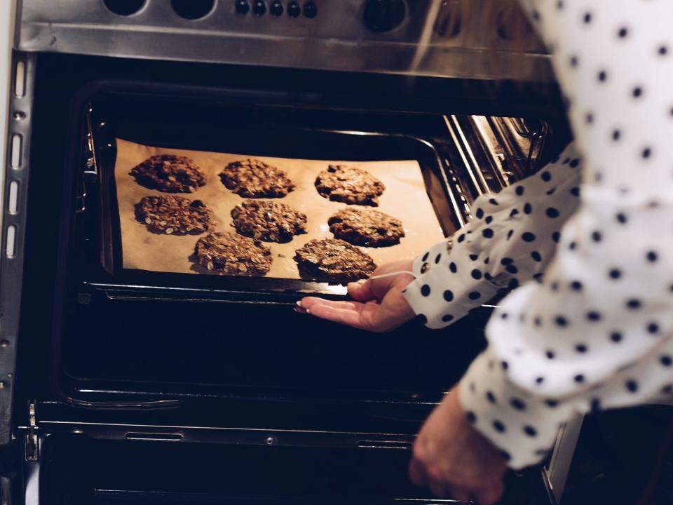 baking putting cookies in oven