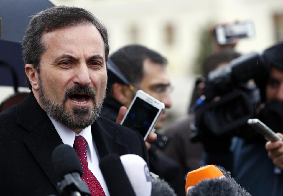 Louay Safi, spokesperson for the Syrian National Coalition, addresses the media after a meeting at the Geneva Conference on Syria, at the United Nations European headquarters in Geneva February 10, 2014. (REUTERS/Denis Balibouse)