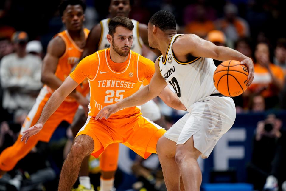 Tennessee guard Santiago Vescovi (25) guards Missouri guard Nick Honor (10) during the first half of a SEC Men’s Basketball Tournament quarterfinal game at Bridgestone Arena in Nashville, Tenn., Friday, March 10, 2023.