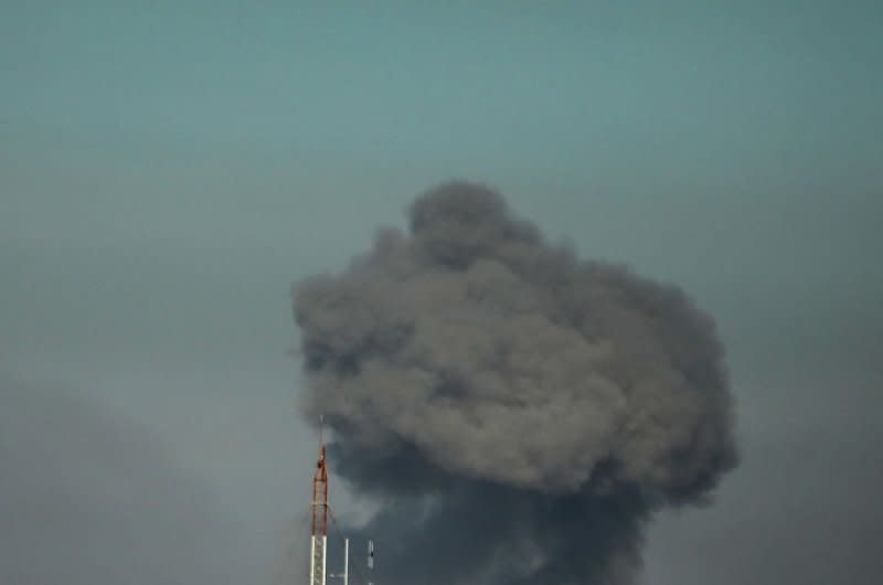 A picture taken from Rafah in the southern Gaza Strip shows smoke rising over buildings in Khan Younis following Israeli bombardment Gaza Strip on Thursday. Some 110 people, including 25 in Rafah, were killed in Israeli airstrikes overnight Saturday, Palestinian health officials said. Photo by Ismael Mohamad/UPI.