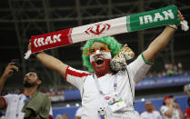 <p>An Iranian fan cheers on his team as they warm up prior to the start of the group B match (AP) </p>