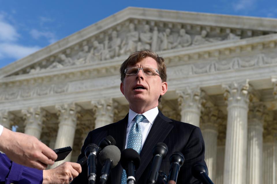 In this Dec. 1, 2014, file photo, John P. Elwood, attorney for Anthony D. Elonis, who claimed he was just kidding when he posted a series of graphically violent rap lyrics on Facebook about killing his estranged wife, shooting up a kindergarten class and attacking an FBI agent, speaks to reporters outside the Supreme Court in Washington. The Supreme Court threw out Elonis' conviction for making threats on Facebook but dodged the free speech issues that had made the case intriguing to First Amendment advocates. Chief Justice John Roberts, writing for seven justices, said it was not enough for prosecutors to show that Elonis' comments would make a reasonable person feel threatened. But the court did not specify to lower courts exactly what the standard of proof should be.