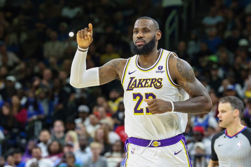 Los Angeles Lakers forward LeBron James (23) signals to a teammate during the second half of a Nov. 4, 2023, NBA basketball game against the Orlando Magic in Orlando, Florida.