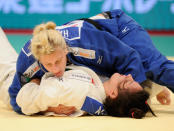 Kayla Harrison of the US holds Mayra Aguiar of Brazil during their women's over 78kg class semi-final match in the Judo Grand Slam tournament in Tokyo on December 11, 2011. Harrison defeated Aguiar. (TORU YAMANAKA/AFP/Getty Images)