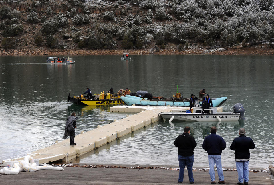 This photo released by Ouray County, shows Ouray County, federal officials and Beegles Aircraft Service Inc. of Greeley, Colo., preparing salvage operations to recover the victims and plane, Thursday March 27, 2014, at the Ridgway Reservoir near Ridgway, Colo., at the site of a downed aircraft, The plane crashed on Saturday, March 22, 2014, killing five people from Alabama. (AP Photo/Ouray County, William Woody)