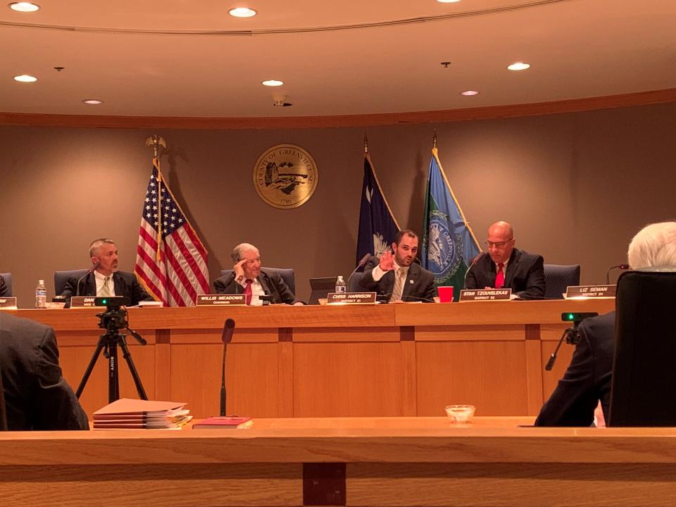 Council members Chris Harrison and Willis Meadows discuss a fee-in-lieu of tax agreement at a Greenville County Council meeting on Tuesday, Oct. 19.