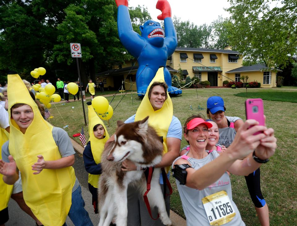 Mary Lujan of Moore, Okla., takes a selfie with the bananas at Gorilla Hill during the15th Annual Oklahoma City Memorial Marathon, Sunday, April 26, 2015, in Oklahoma City.  Photo by Sarah Phipps, The Oklahoman