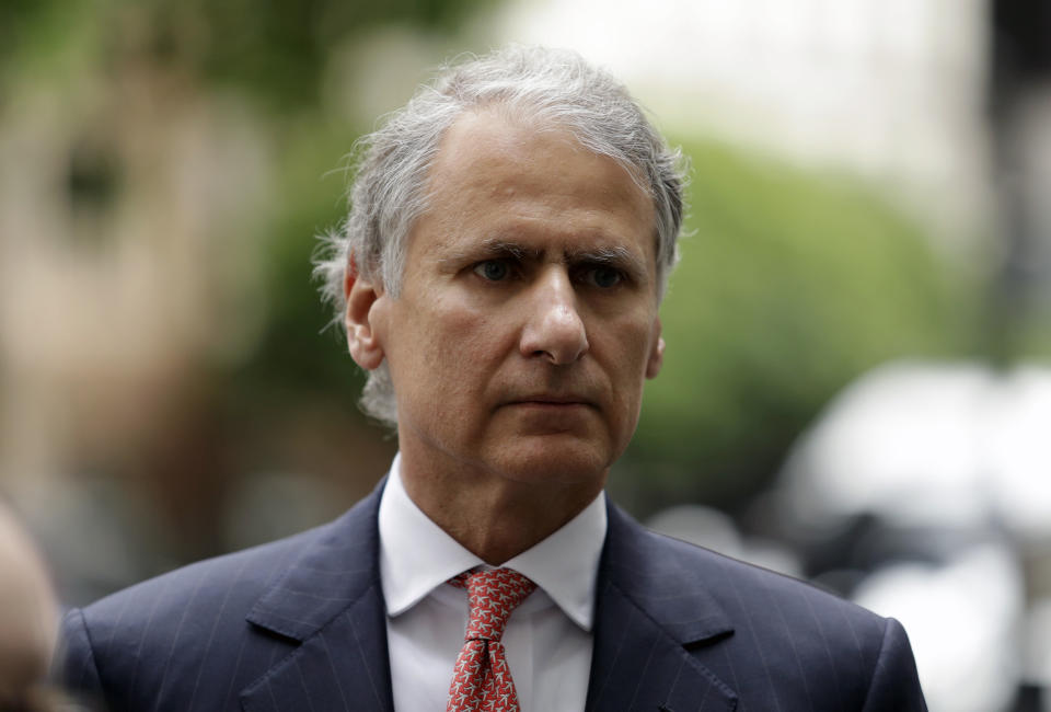 FILE - In this Monday, July 3, 2017 file photo, Former Barclays Chief Thomas Kalaris arrives for a hearing for charges of fraud at Westminster Magistrates Court, London. Kalaris and three ex colleagues attended the hearing Monday. Three former Barclays bankers have been cleared of fraud over a 4 billion-pound ($5.2 billion) investment deal with Qatar at the height of the global financial crisis in 2008. The three men — Roger Jenkins, Thomas Kalaris and Richard Boath — were acquitted Friday, Feb. 28, 2020 after a five-month trial at London's Old Bailey. (AP Photo/Matt Dunham, file)