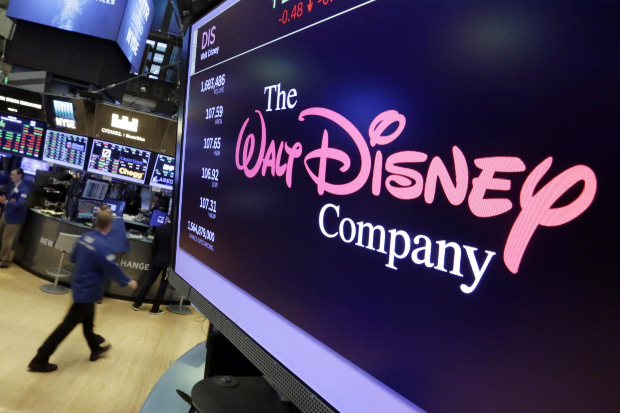 FILE - The Walt Disney Co. logo appears on a screen above the floor of the New York Stock Exchange on Aug. 8, 2017, in New York. The Walt Disney Co., reports their earnings on Thursday, May 11, 2023. (AP Photo/Richard Drew, File)