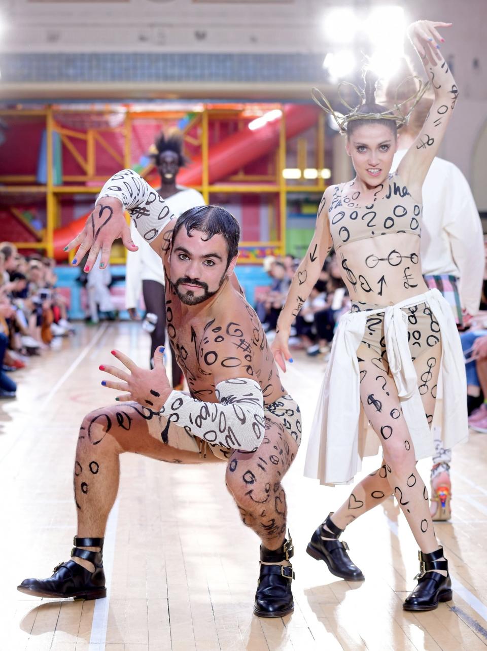 <p>Dancers were painted with zeroes in a reference to the money wasted by the government.<br><i>[Photo: PA]</i> </p>