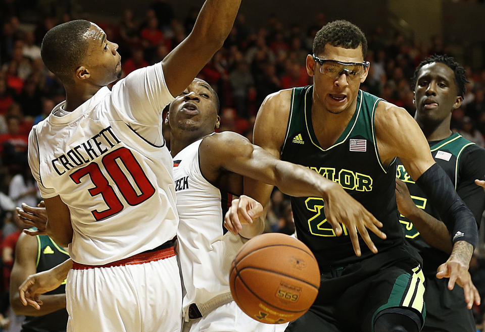 Texas Tech's Jaye Crockett (30) and Randy Onwuasor, center, battle for a loose ball against Baylor's Isaiah Austin (21) and Taurean Prince, right, during an NCAA college basketball game in Lubbock, Texas, Wednesday, Jan, 15, 2014. (AP Photo/Lubbock Avalanche-Journal, Tori Eichberger) ALL LOCAL TV OUT