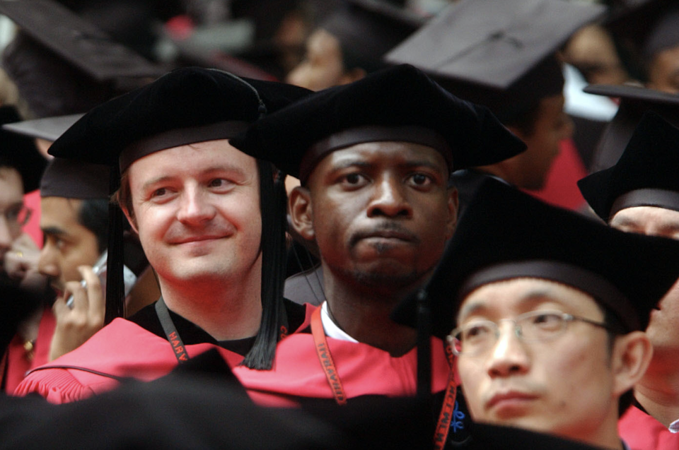 Harvard University students listen as commencement ceremonies wrap up at Harvard University June 7, 2007 in Cambridge, Massachusetts. Microsoft co-founder and Chairman Bill Gates, who enrolled at Harvard in a pre-law program in 1973 and left in his junior year, received an honorary Doctor of Laws degree. (Photo: Getty)