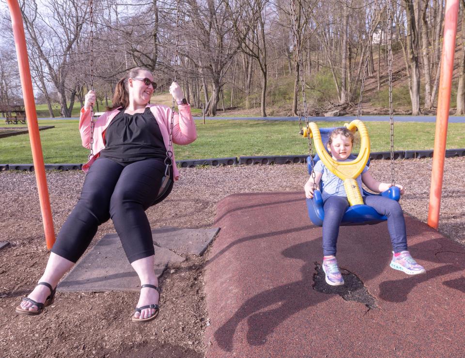 Darla Harris and her daughter Lyla Harris, 5, of Marshallville swing Monday, April 8, 2024, at Massillon's Reservoir Park.