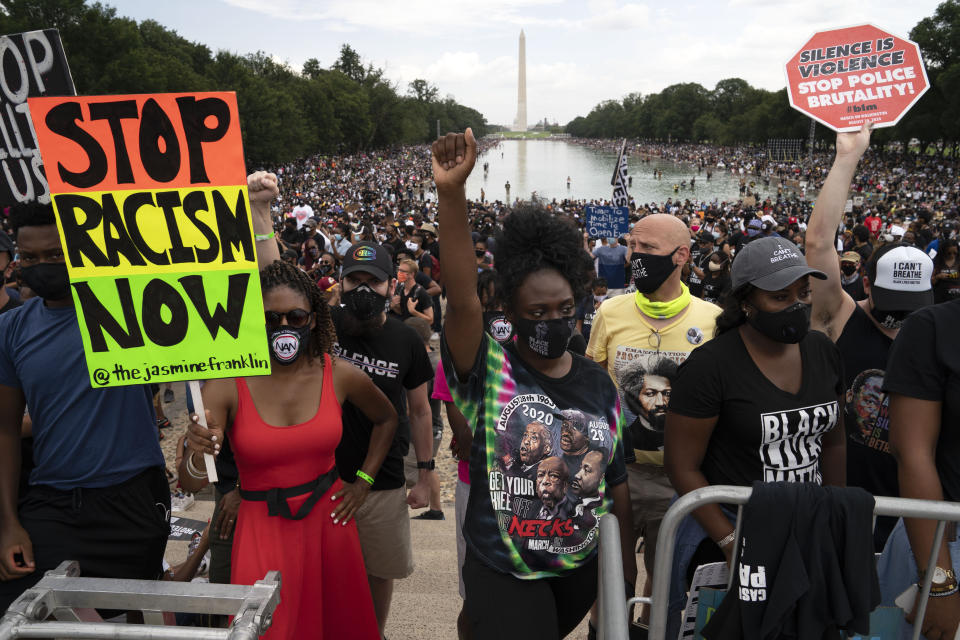 Demonstrators rally at Lincoln Memorial during the March on Washington, Friday Aug. 28, 2020, on the 57th anniversary of the Rev. Martin Luther King Jr.'s "I Have A Dream" speech. (AP Photo/Jose Luis Magana)