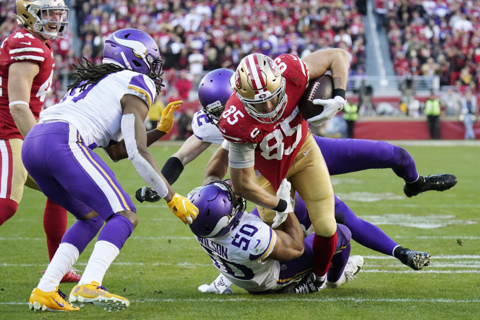 San Francisco 49ers tight end George Kittle (85) runs as Minnesota Vikings linebacker Eric Wilson (50) attempts a tackle during the second half of an NFL divisional playoff football game, Saturday, Jan. 11, 2020, in Santa Clara, Calif. (AP Photo/Tony Avelar)