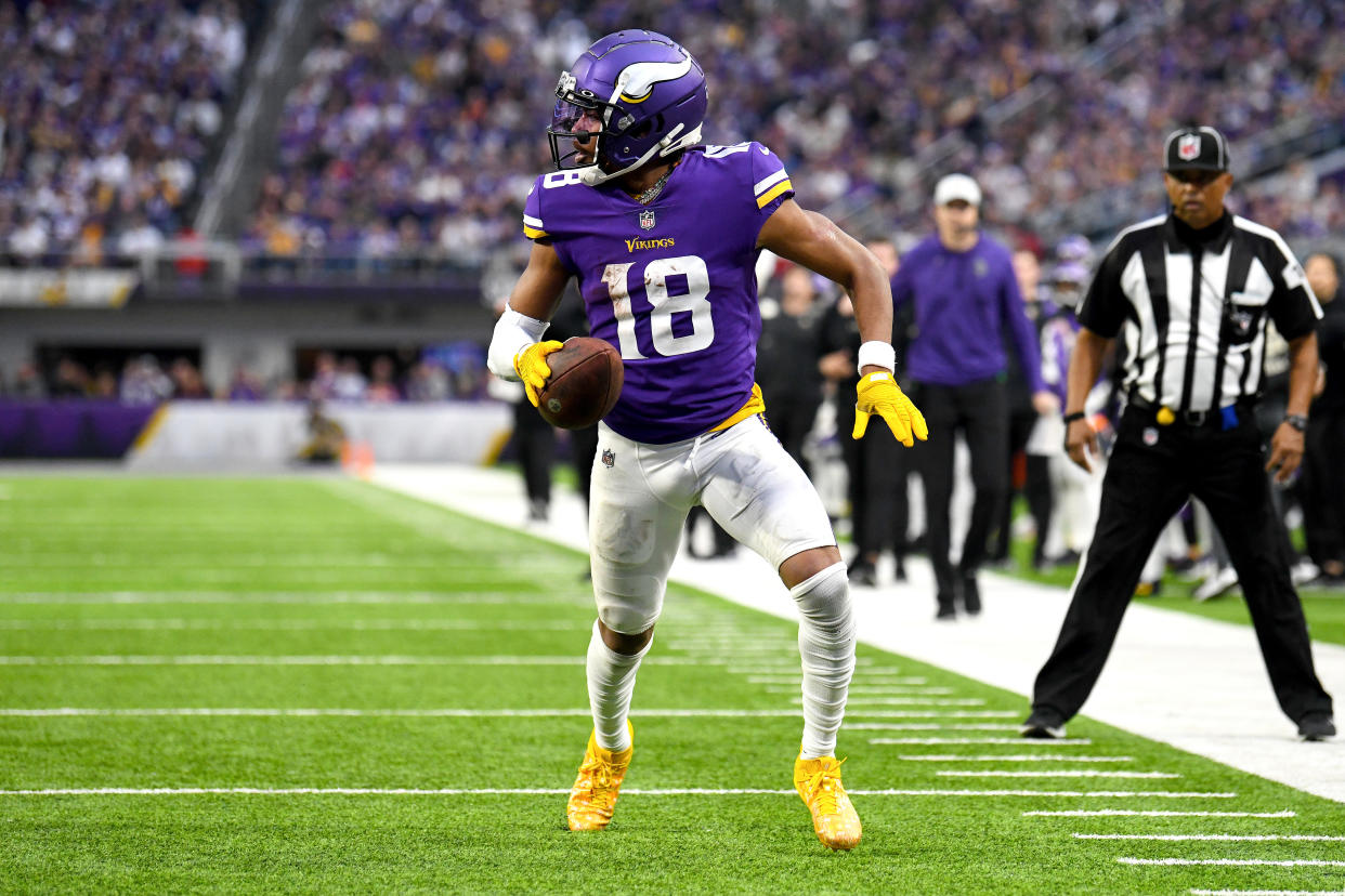 MINNEAPOLIS, MINNESOTA - DECEMBER 17: Justin Jefferson #18 of the Minnesota Vikings scores a touchdown against the Indianapolis Colts during the fourth quarter of the game at U.S. Bank Stadium on December 17, 2022 in Minneapolis, Minnesota. (Photo by Stephen Maturen/Getty Images)