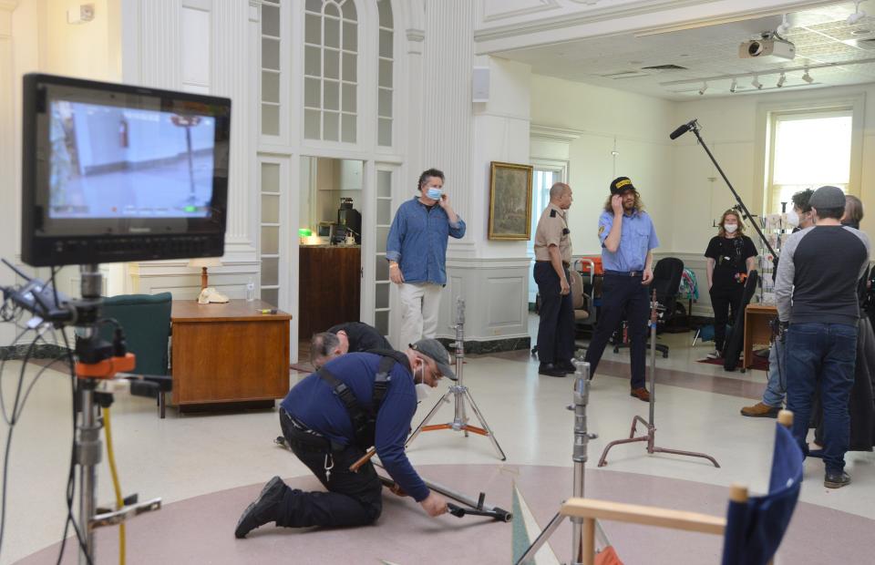 Director Arthur Egeli, standing left, oversees filming of his movie "Art Thief" about the Gardner museum art heist, taking over the Great Hall at the Cultural Center of Cape Cod which has been transformed to look like the famous museum.
