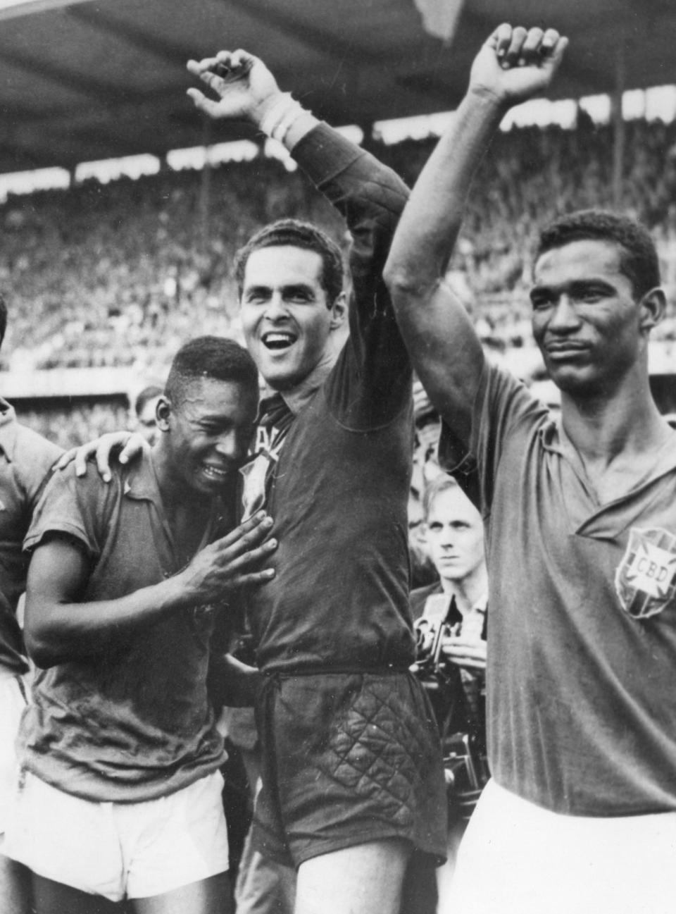 FILE - In this June 29, 1958 file photo, Brazil's 17-year-old Pele, left, weeps on the shoulder of goalkeeper Gylmar Dos Santos Neves, as Didi stands right, after Brazil's 5-2 victory over Sweden in the final of the soccer World Cup in Stockholm, Sweden. On Oct. 23, 2020, the three-time World Cup winner Pelé turns 80 without a proper celebration amid the COVID-19 pandemic as he quarantines in his mansion in the beachfront city of Guarujá, where he has lived since the start of the pandemic. (AP Photo, File)