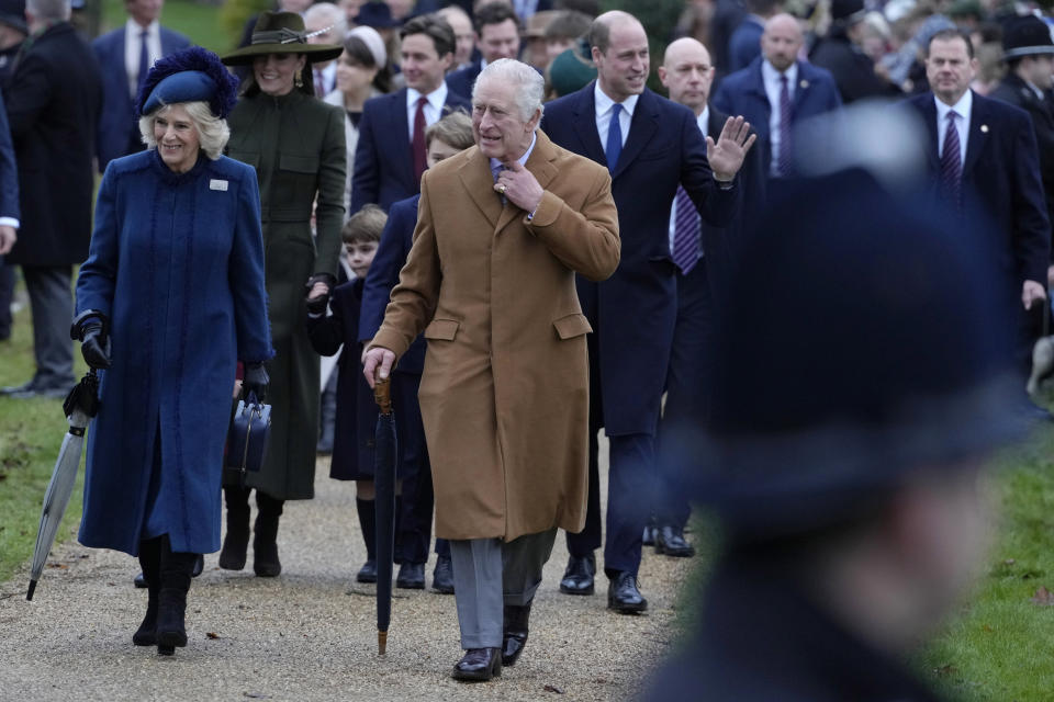 FILE - King Charles III, centre, and Camilla, the Queen Consort lead the Royal Family as they arrive to attend the Christmas day service at St Mary Magdalene Church in Sandringham in Norfolk, England, Sunday, Dec. 25, 2022. (AP Photo/Kirsty Wigglesworth, File)