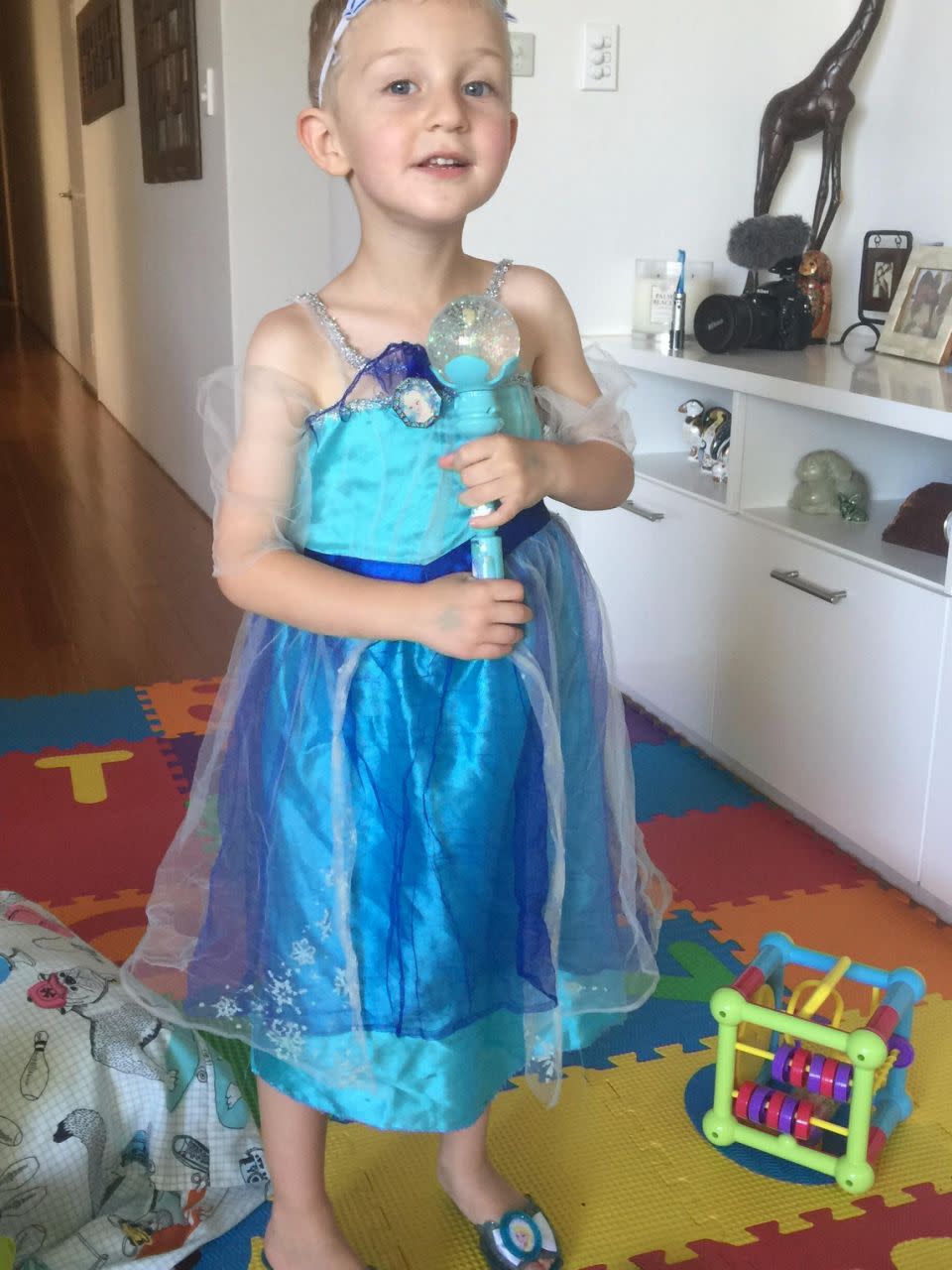 Noah, wearing his favourite Elsa dress and shoes. Source: Supplied