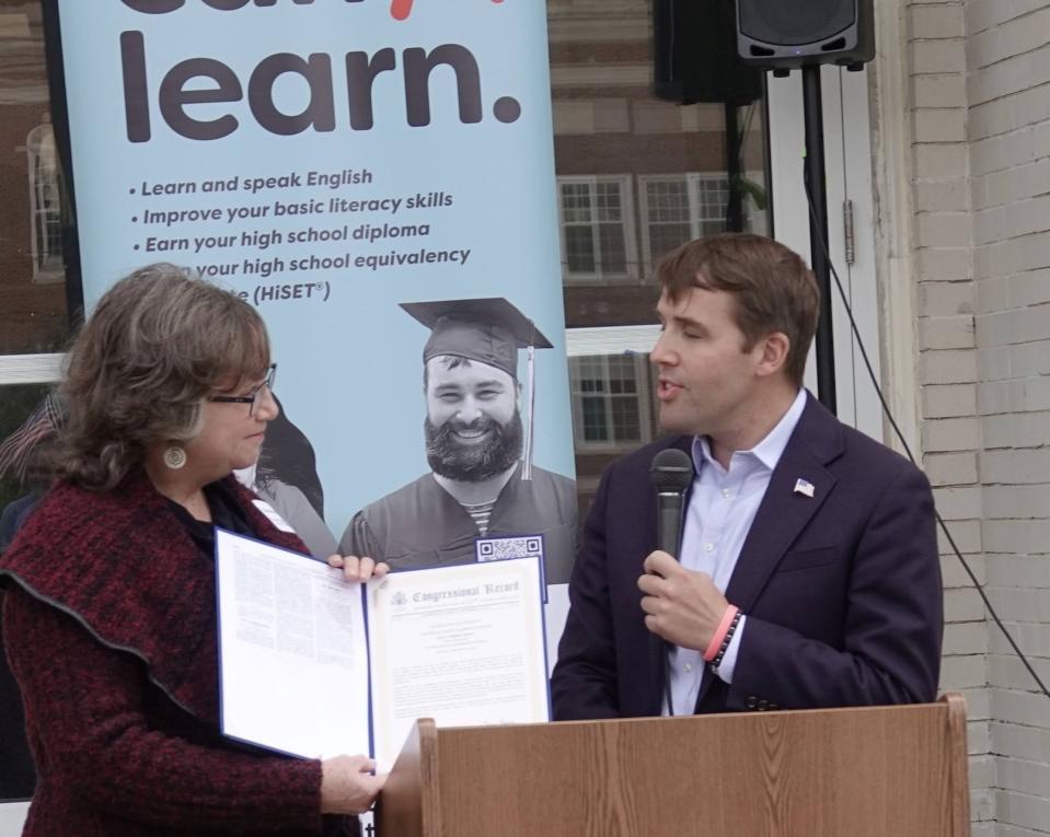 U.S. Congressman Chris Pappas presents a proclamation that was read into the Congressional Record to DALC Executive Director Deanna Strand on Tuesday, Oct. 4, 2022.